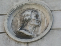 Facciata del palazzo di San Crispino (piazza Trento e Trieste), ritratto dell&#039;autore di musica sacra Brizio Petrucci